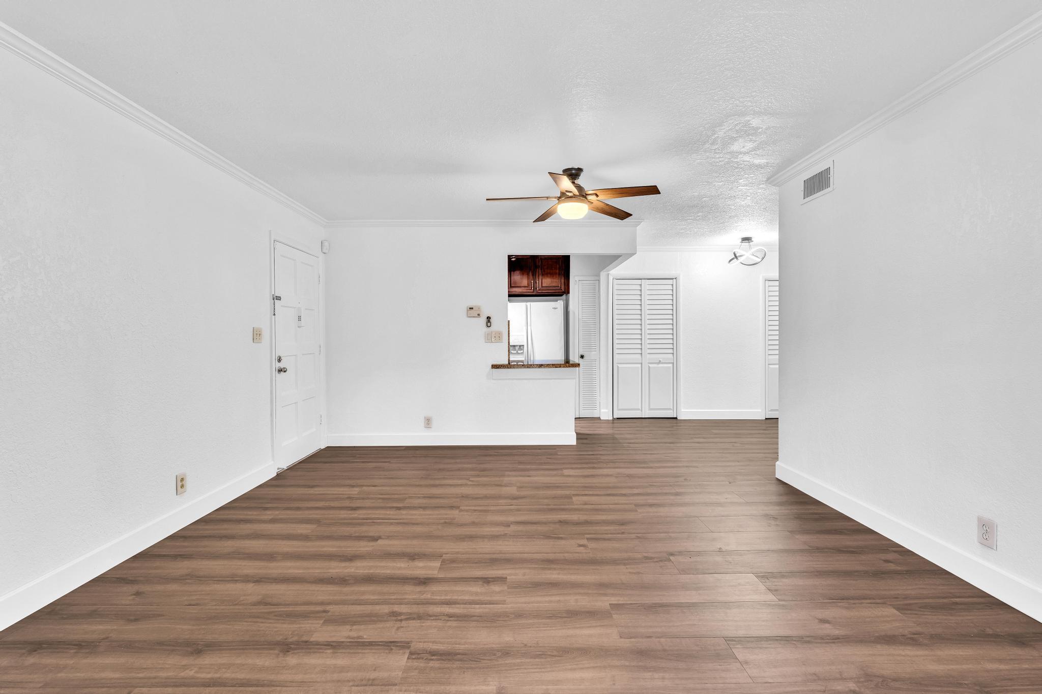 1291 Northwest 13th Street, Unit 445D Boca Raton, FL 33486 - Photo 17 of 50 a view of empty room with wooden floor