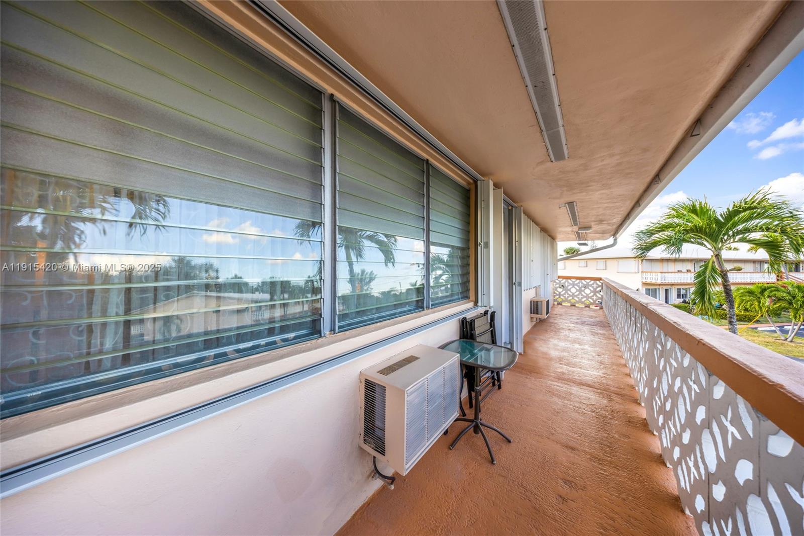 900 Southwest 10th Terrace, Unit 14S Hallandale Beach, FL 33009 - Photo 19 of 31 a view of a balcony with wooden floor