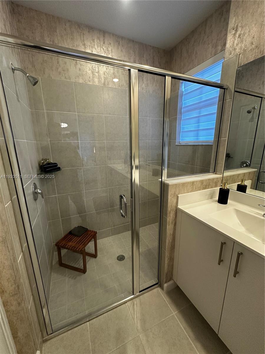 2288 Southeast 30th Street, Unit 1 Homestead, FL 33035 - Photo 21 of 23 a bathroom with a shower and sink