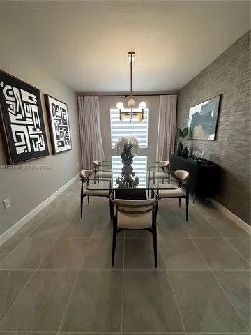 a living room with furniture a table and a window
