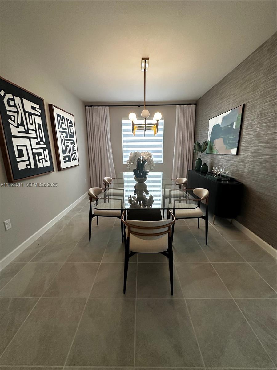 2288 Southeast 30th Street, Unit 1 Homestead, FL 33035 - Photo 5 of 23 a living room with furniture a table and a window