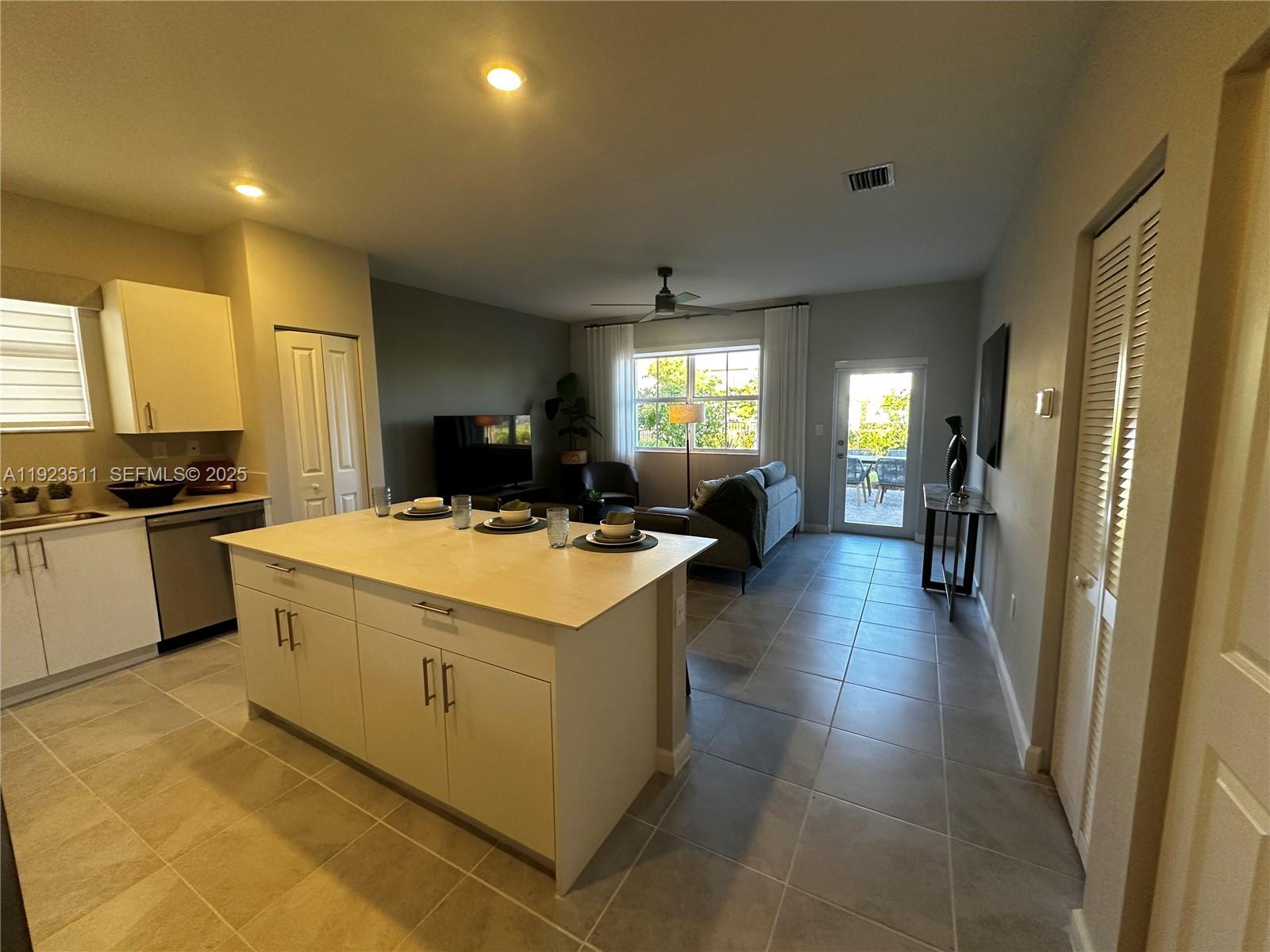 2288 Southeast 30th Street, Unit 1 Homestead, FL 33035 - Photo 6 of 23 a kitchen with a stove and a refrigerator