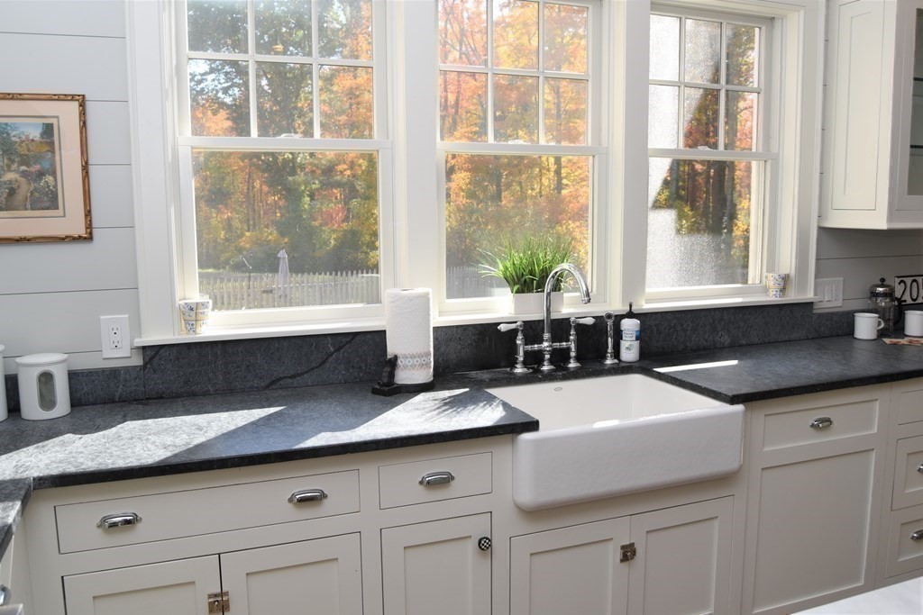 205 North Street Belchertown, MA 01007 - Photo 13 of 42 a kitchen with granite countertop a sink and a window