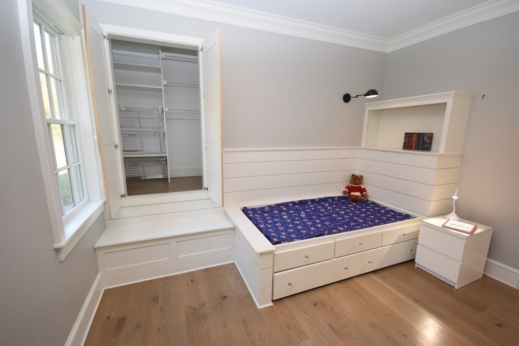 205 North Street Belchertown, MA 01007 - Photo 20 of 42 a bedroom with a bed and cabinets