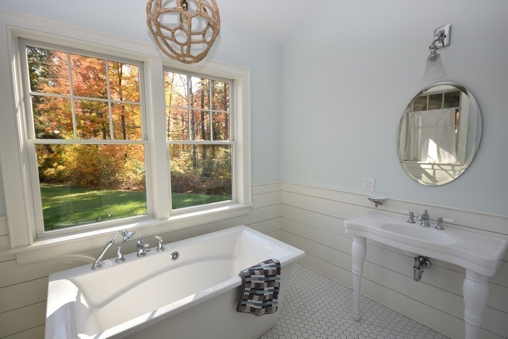 205 North Street Belchertown, MA 01007 - Photo 30 of 42 a bathroom with a sink and a large mirror