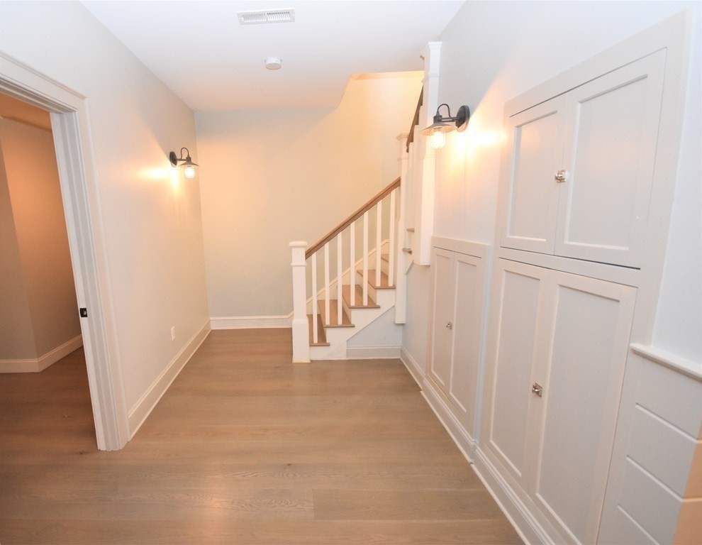 205 North Street Belchertown, MA 01007 - Photo 33 of 42 a view of a hallway with wooden floor and staircase