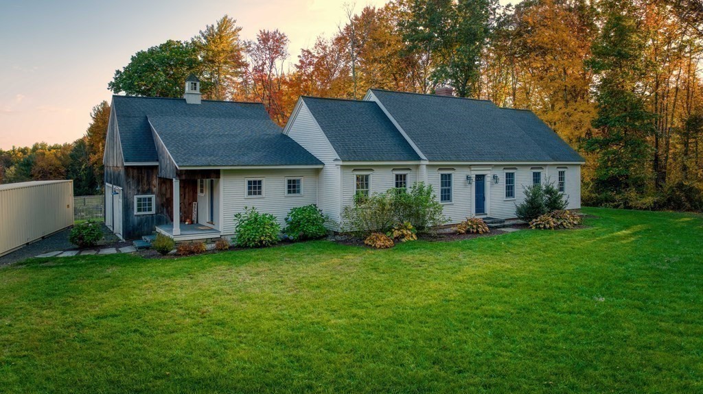205 North Street Belchertown, MA 01007 - Photo 39 of 42 a front view of a house with a garden and yard