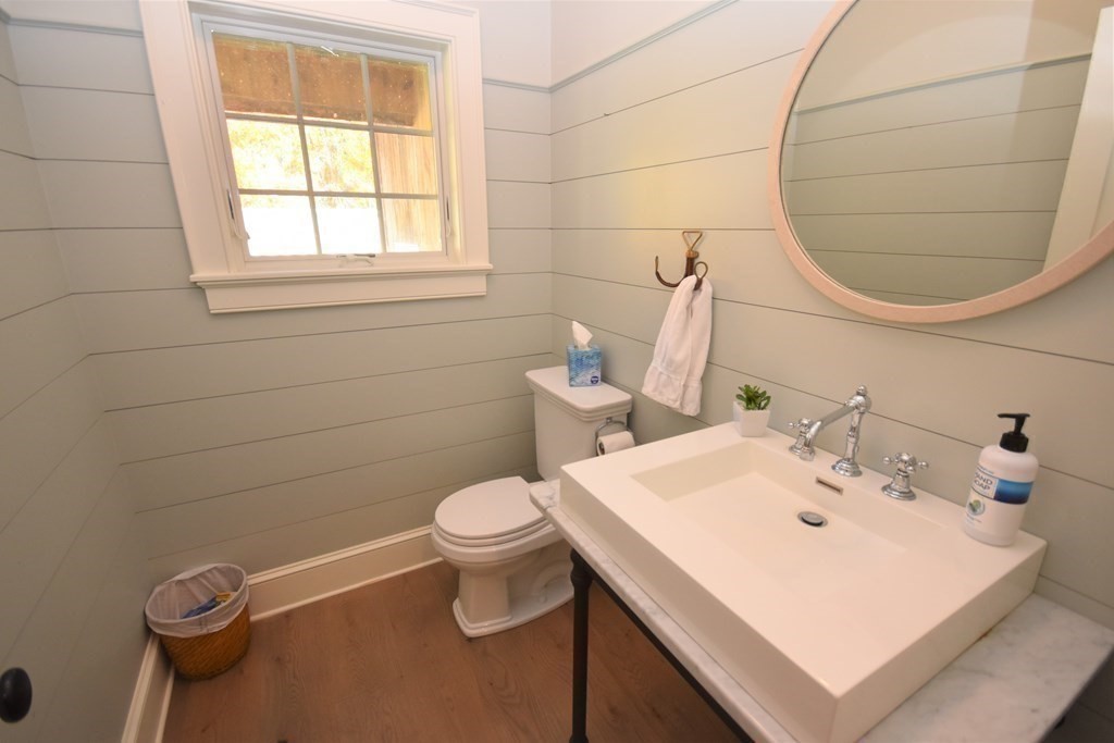205 North Street Belchertown, MA 01007 - Photo 8 of 42 a bathroom with a sink a toilet and a mirror