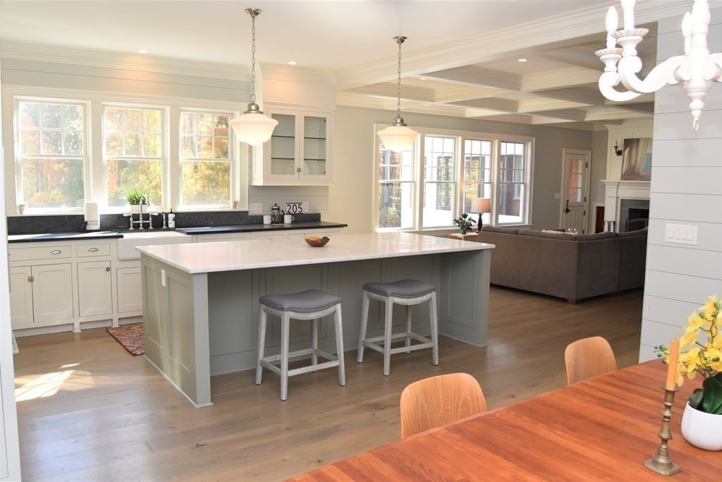 205 North Street Belchertown, MA 01007 - Photo 9 of 42 a kitchen with granite countertop a sink dining table and chairs