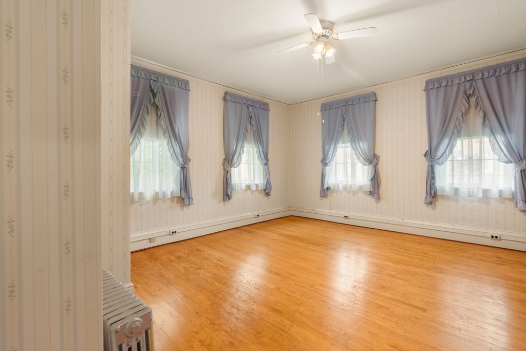 16 Ditson Place Methuen, MA 01844 - Photo 12 of 39 wooden floor in an empty room with a window