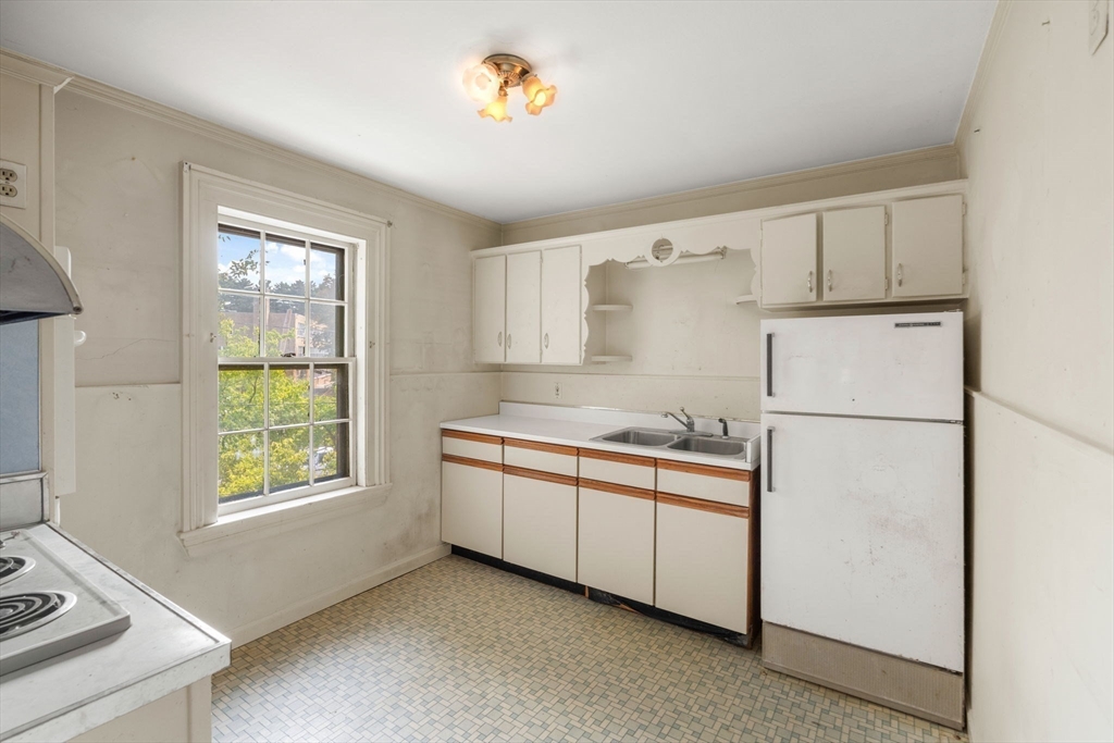 16 Ditson Place Methuen, MA 01844 - Photo 15 of 39 a kitchen with stainless steel appliances a refrigerator sink and stove