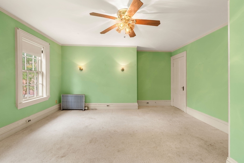 16 Ditson Place Methuen, MA 01844 - Photo 17 of 39 a view of an empty room with window and a ceiling fan