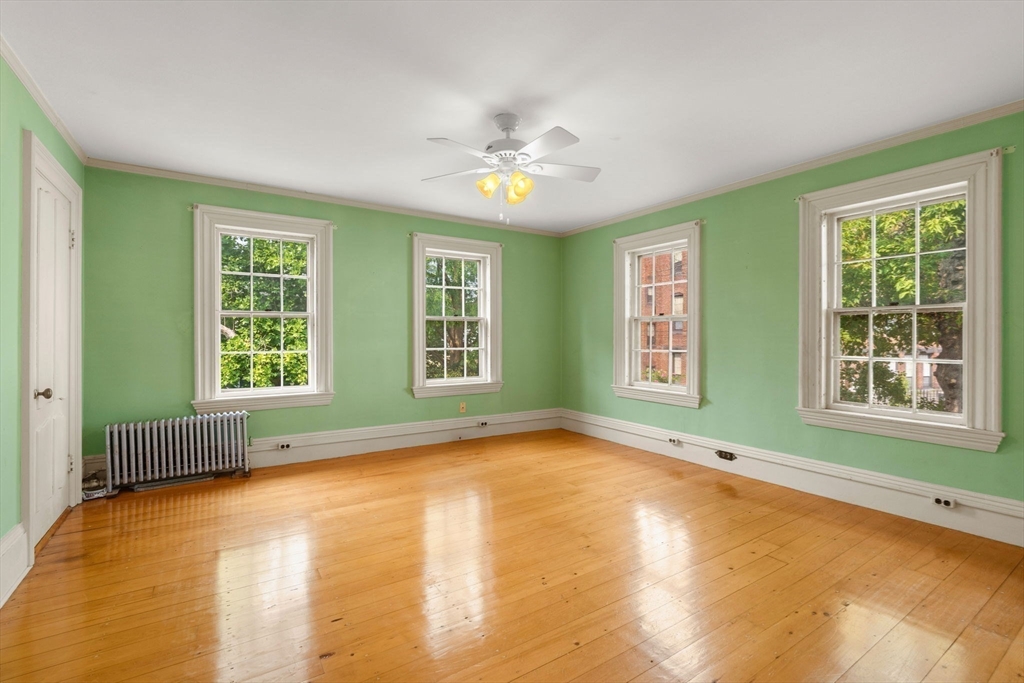 16 Ditson Place Methuen, MA 01844 - Photo 18 of 39 a view of an empty room with a window and a kitchen