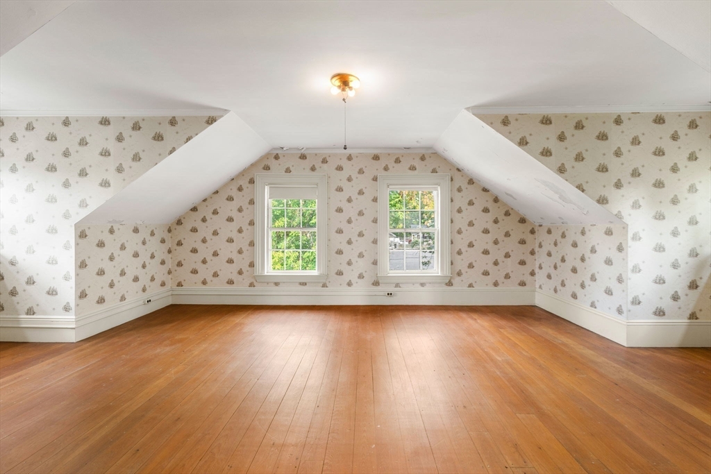 16 Ditson Place Methuen, MA 01844 - Photo 22 of 39 a view of a big room with windows and wooden floor