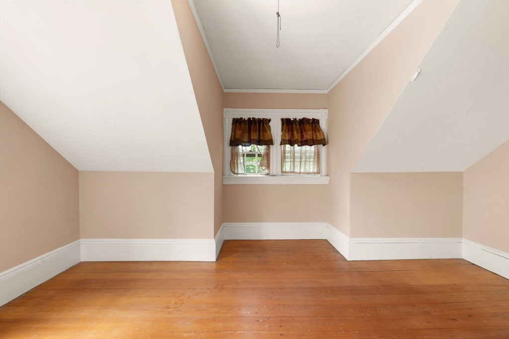 16 Ditson Place Methuen, MA 01844 - Photo 23 of 39 a view of empty room with wooden floor and fan