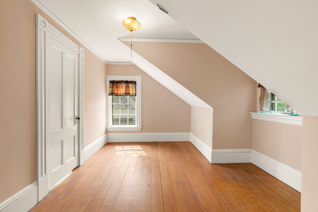 16 Ditson Place Methuen, MA 01844 - Photo 25 of 39 a view of an empty room with wooden floor and a window