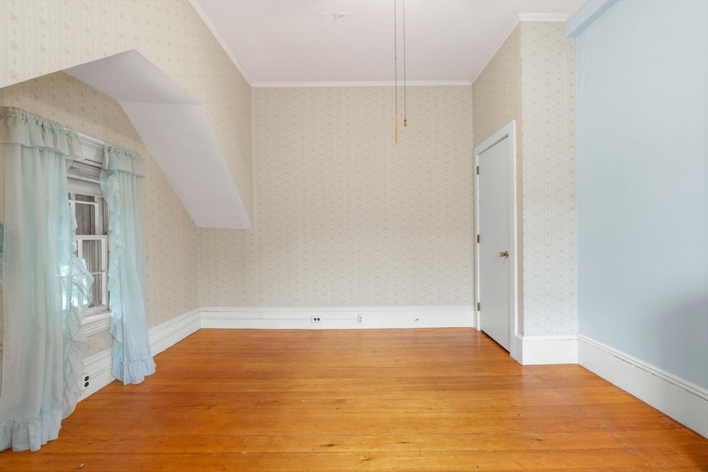 16 Ditson Place Methuen, MA 01844 - Photo 27 of 39 a view of empty room with wooden floor