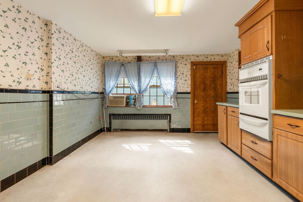 16 Ditson Place Methuen, MA 01844 - Photo 8 of 39 a view of a kitchen with furniture and cabinet