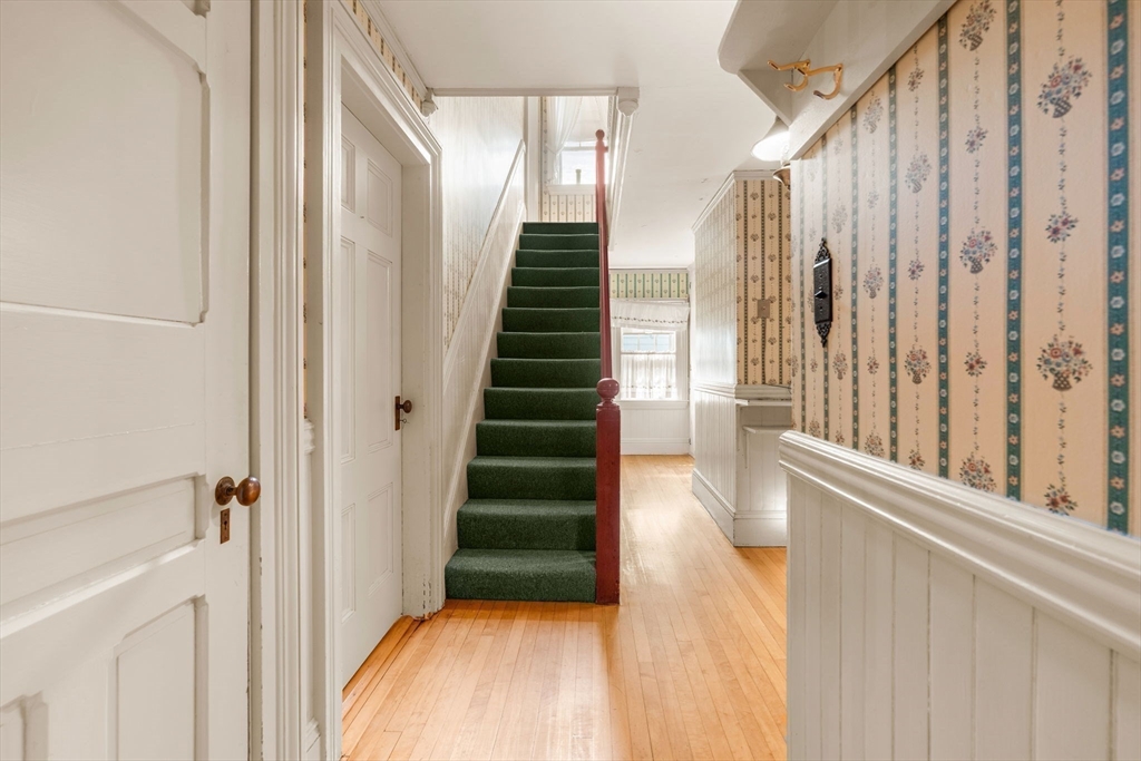 16 Ditson Place Methuen, MA 01844 - Photo 9 of 39 a view of entryway with wooden floor and stairs