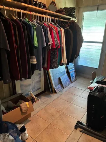 a kitchen with sink a stove and cabinets