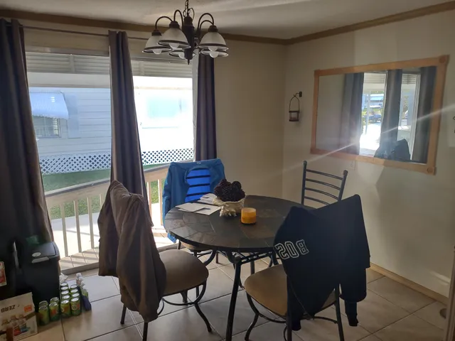 a living room with furniture and a book shelf