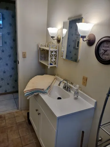 a living room with furniture and a dining table