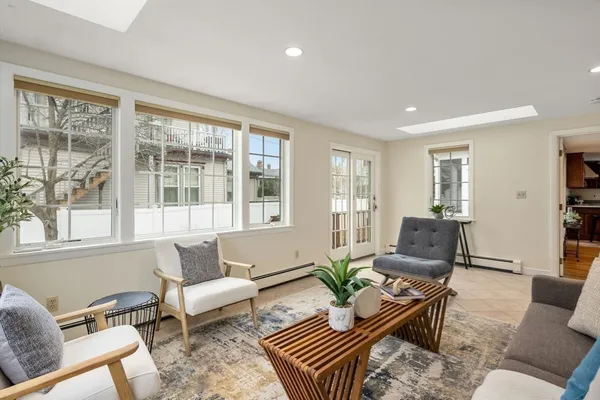 a living room with furniture and a window