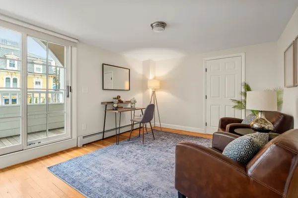 a living room with furniture and a rug