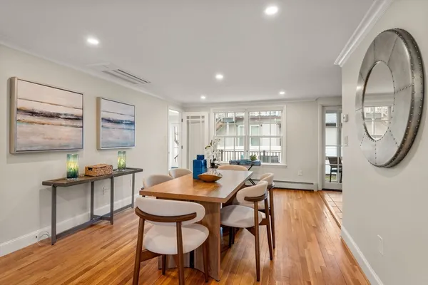 a view of a dining room with furniture window and wooden floor