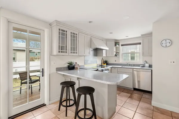a kitchen with sink cabinets and window