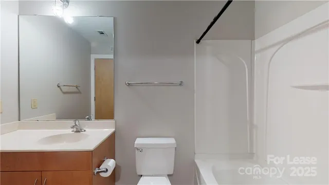 a bathroom with a sink toilet and vanity