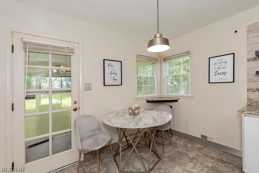 23655 Wimbledon Road Shaker Heights, OH 44122 - Photo 5 of 23 Dining space featuring dark tile flooring