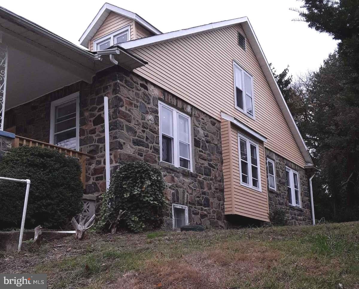 71 Hillside Road Wilmington, DE 19804 - Photo 2 of 25 side view with stone and new siding and windows