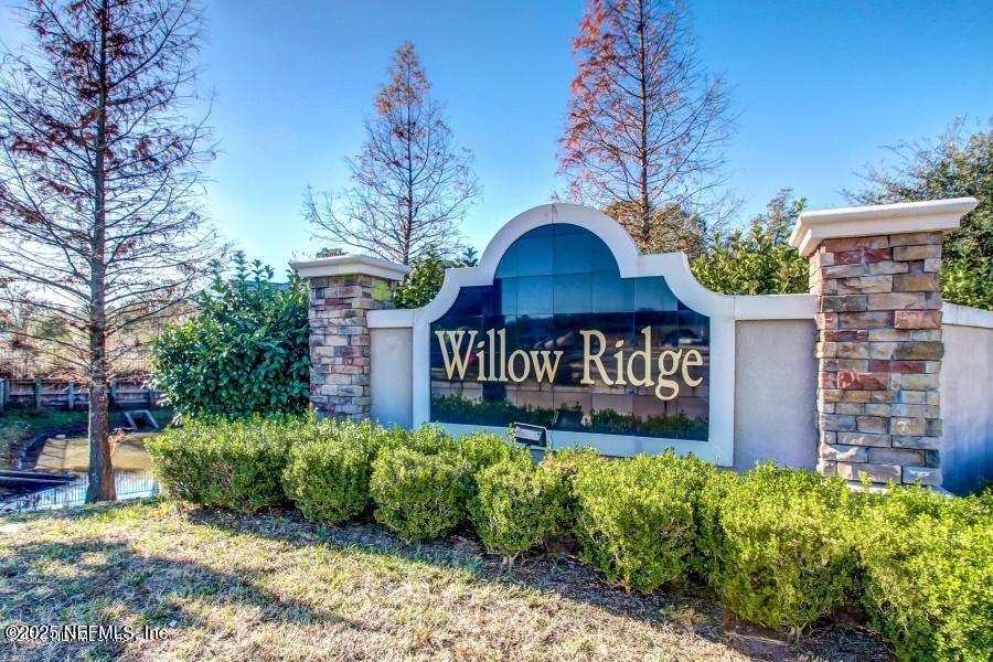 a view of a bench in a yard next to a building