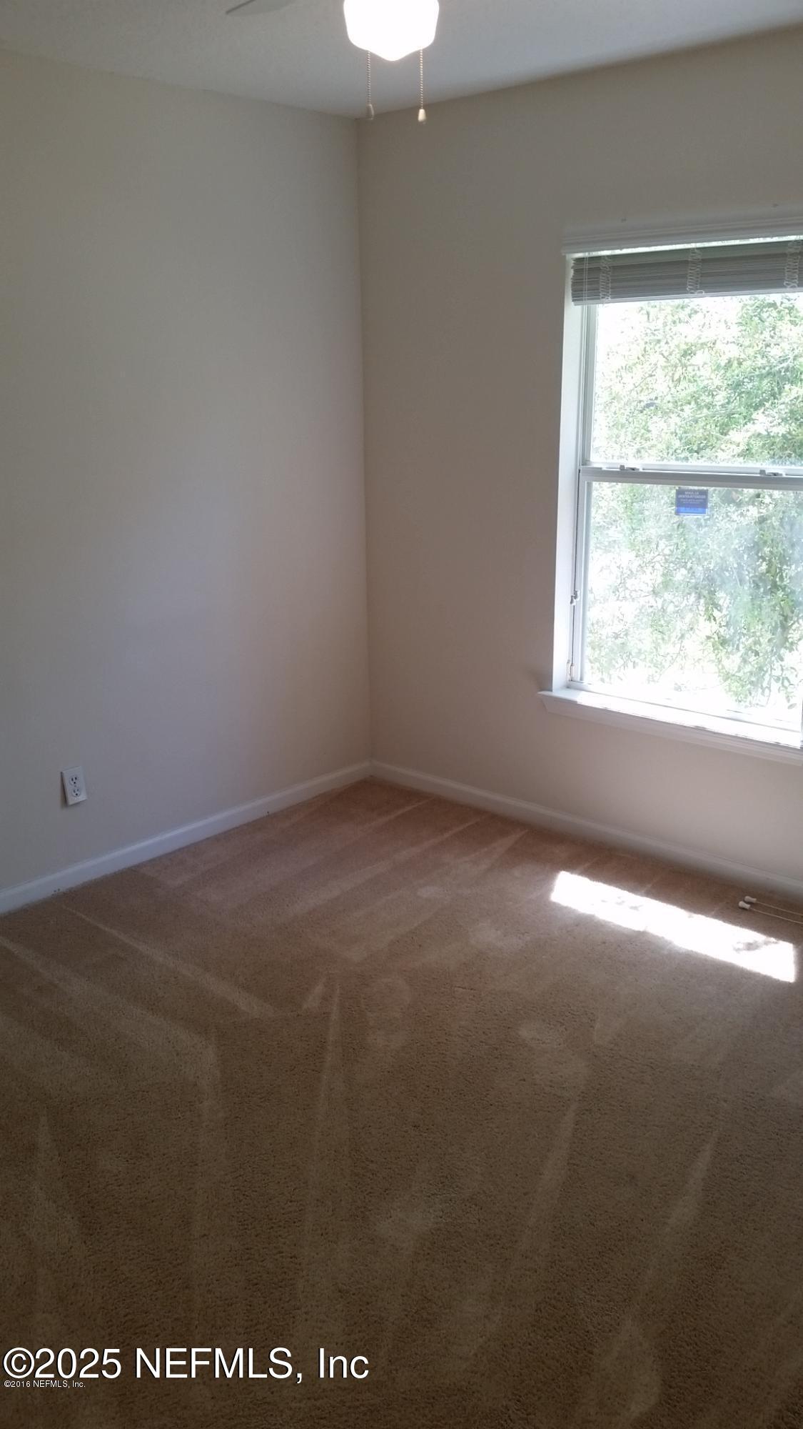 3620 Kirkpatrick Circle, Unit 16 Jacksonville, FL 32210 - Photo 14 of 17 an empty room with a window