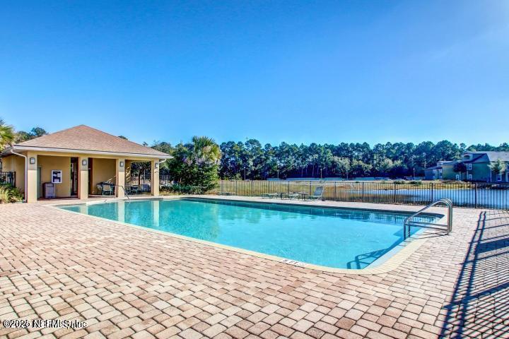 3620 Kirkpatrick Circle, Unit 16 Jacksonville, FL 32210 - Photo 17 of 17 a view of a house with swimming pool and a yard