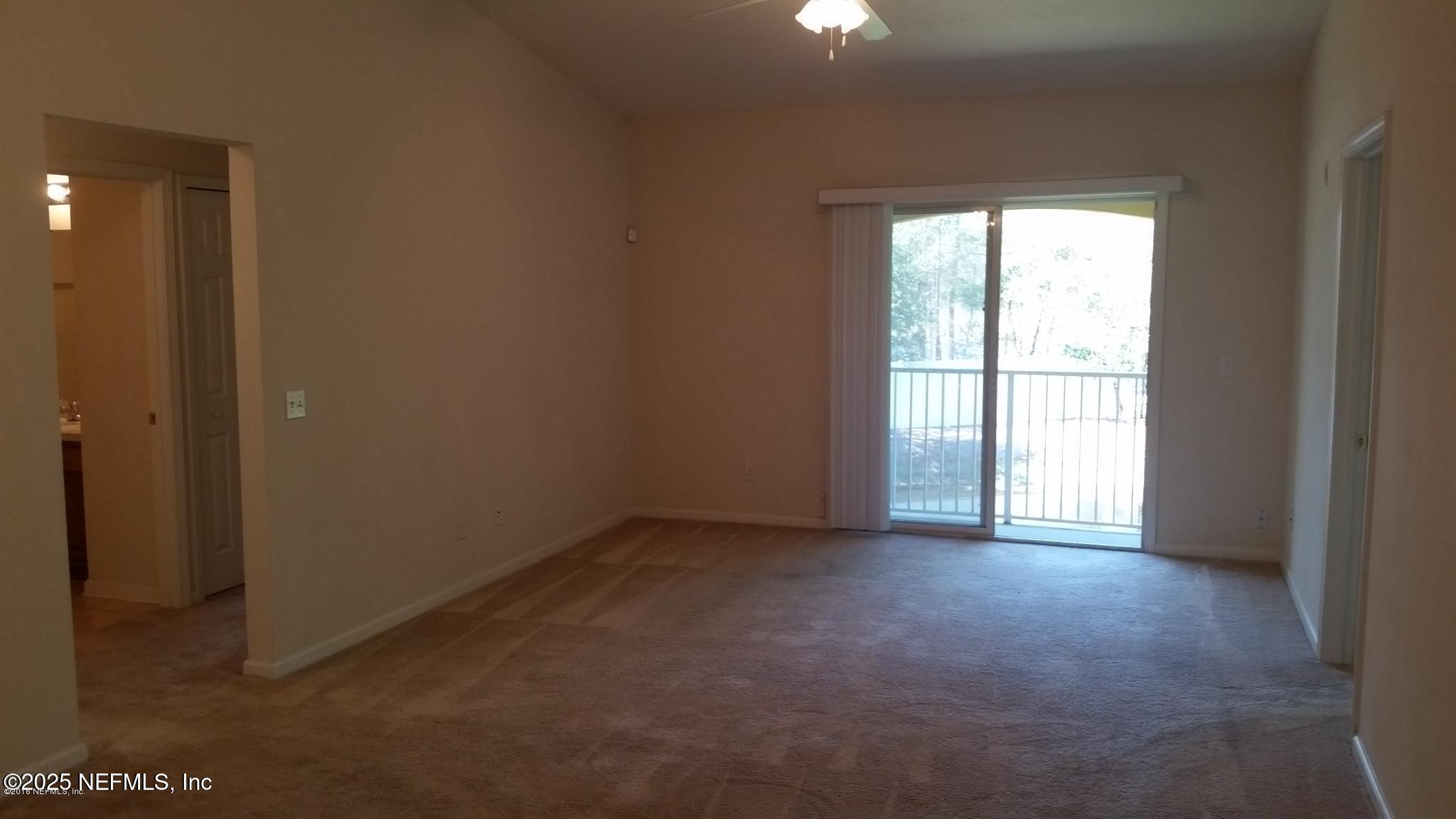 3620 Kirkpatrick Circle, Unit 16 Jacksonville, FL 32210 - Photo 3 of 17 an empty room with windows