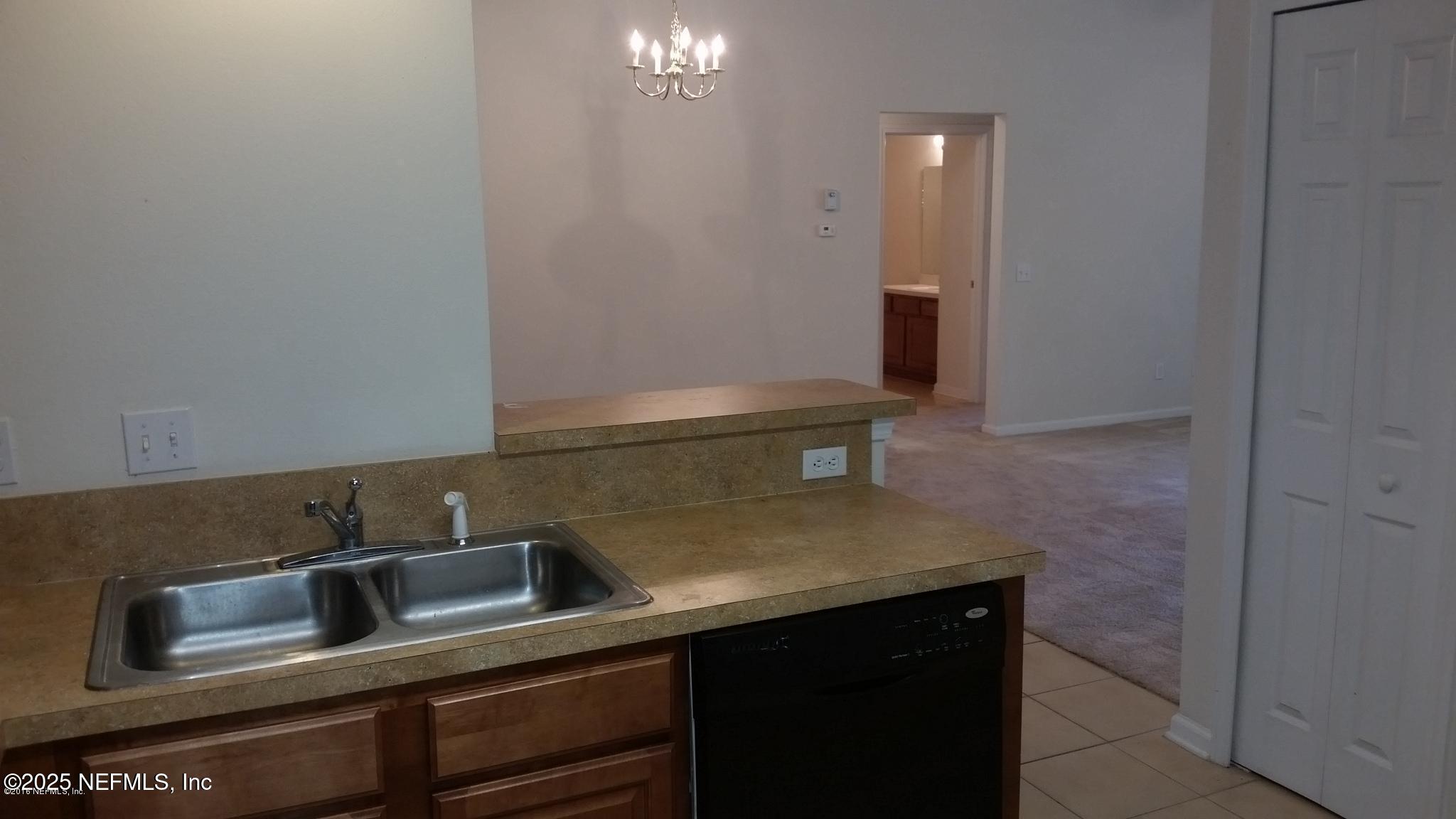 3620 Kirkpatrick Circle, Unit 16 Jacksonville, FL 32210 - Photo 6 of 17 a close view of sink and microwave