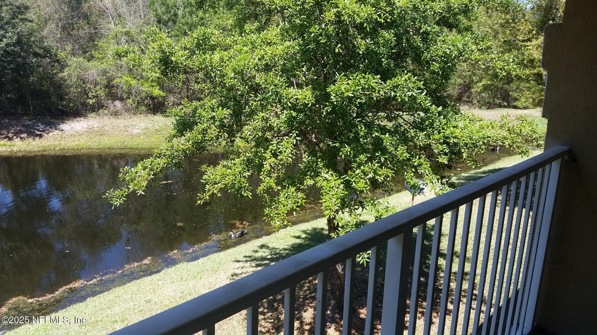 3620 Kirkpatrick Circle, Unit 16 Jacksonville, FL 32210 - Photo 7 of 17 a balcony with trees in front of it