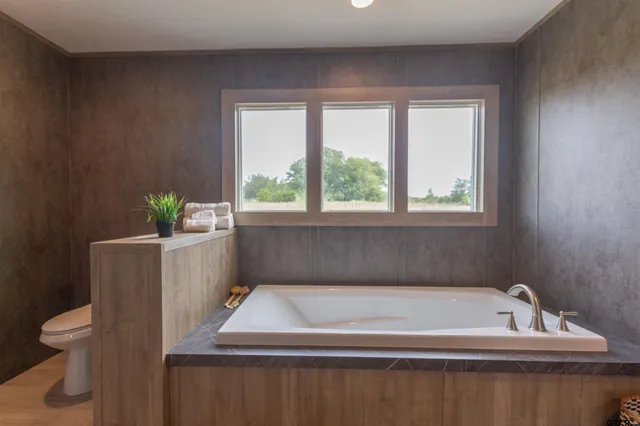 a room with a bed and a window