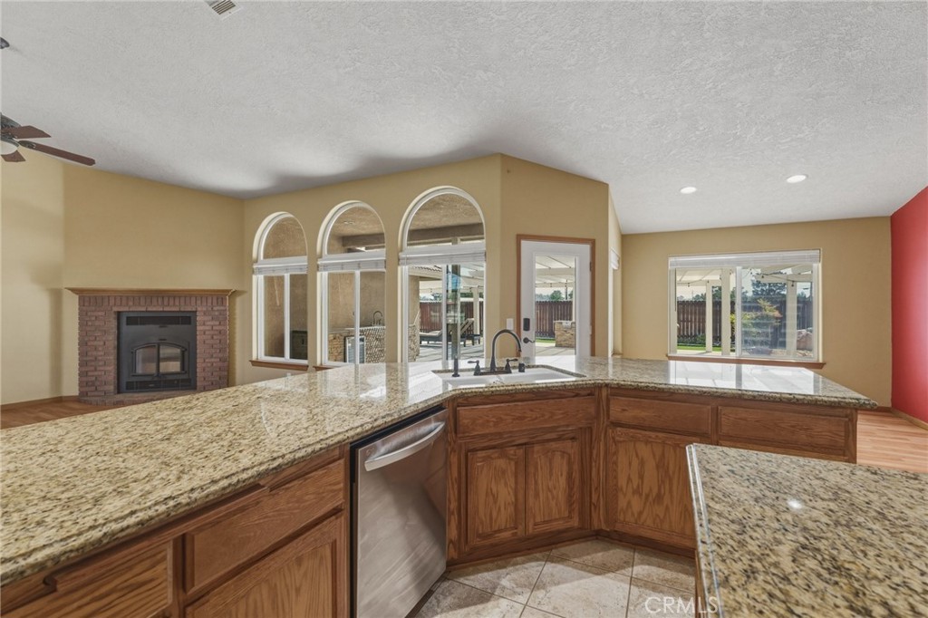 19501 Kinai Road Apple Valley, CA 92307 - Photo 17 of 49 a large white kitchen with a large window