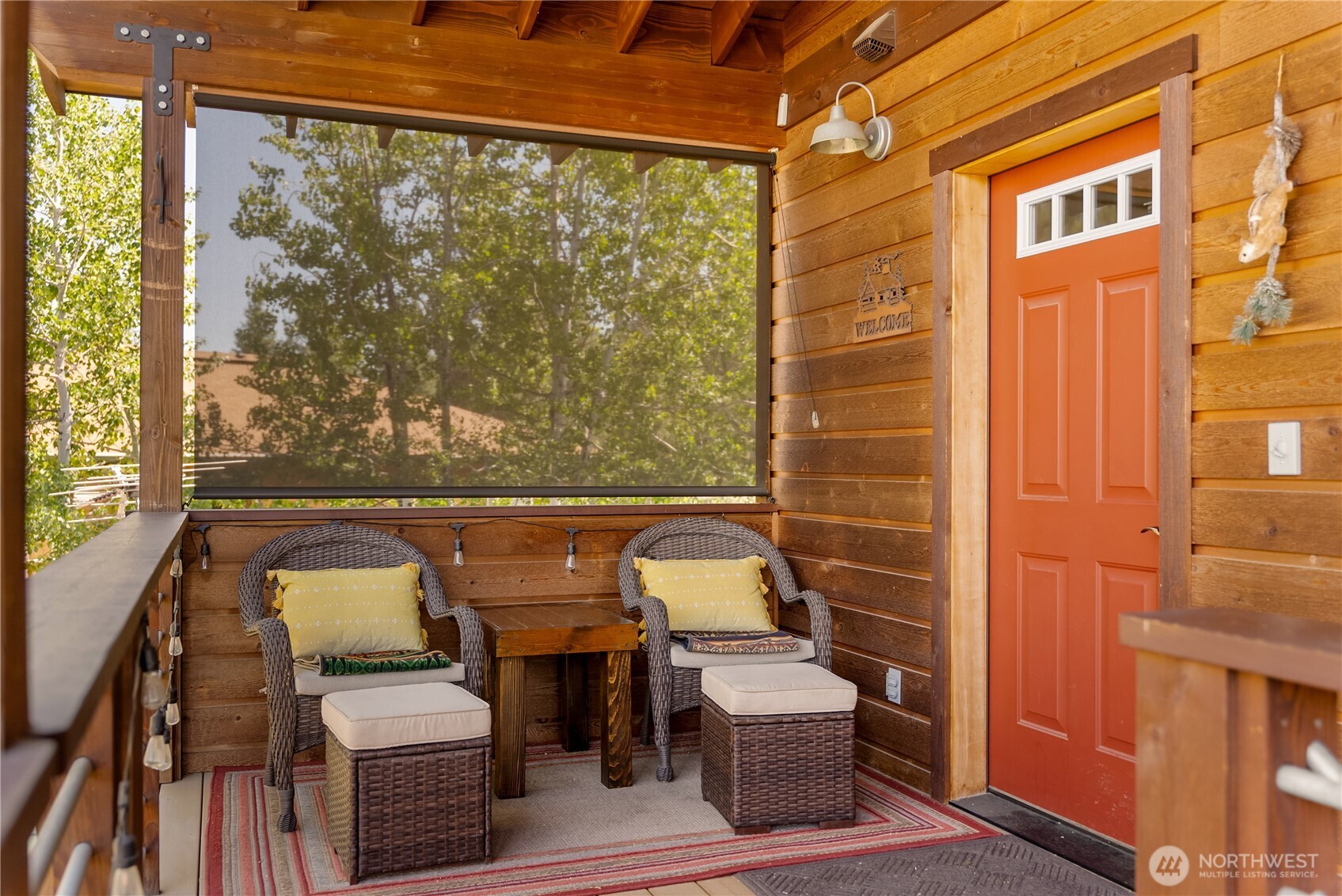 130 Sundown Road Winthrop, WA 98862 - Photo 30 of 40 a balcony with couple of chairs and a swing