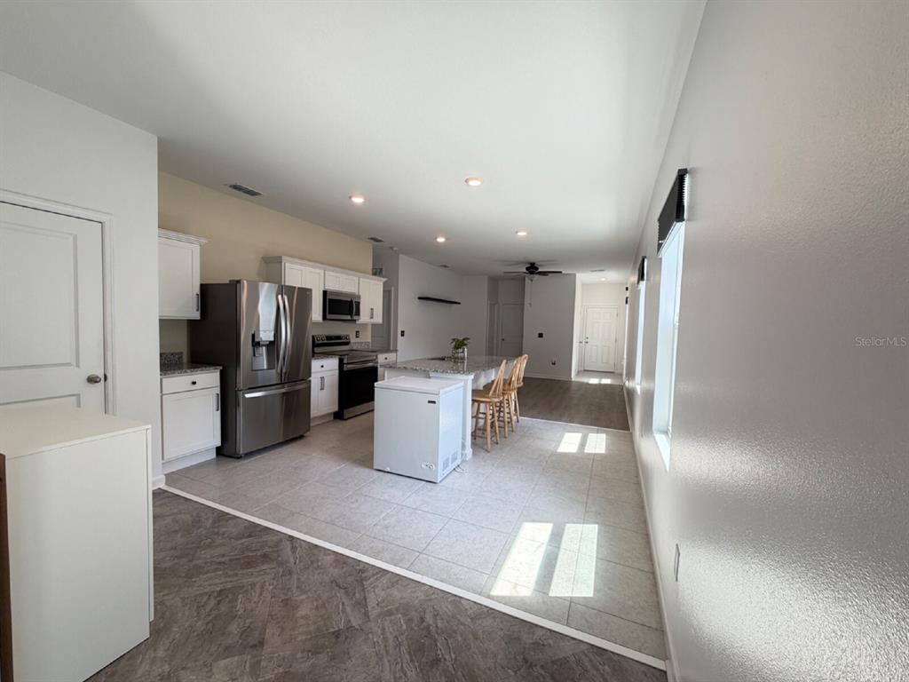 2021 Hemingway Circle Groveland, FL 34736 - Photo 4 of 18 a kitchen with stainless steel appliances a refrigerator and a sink