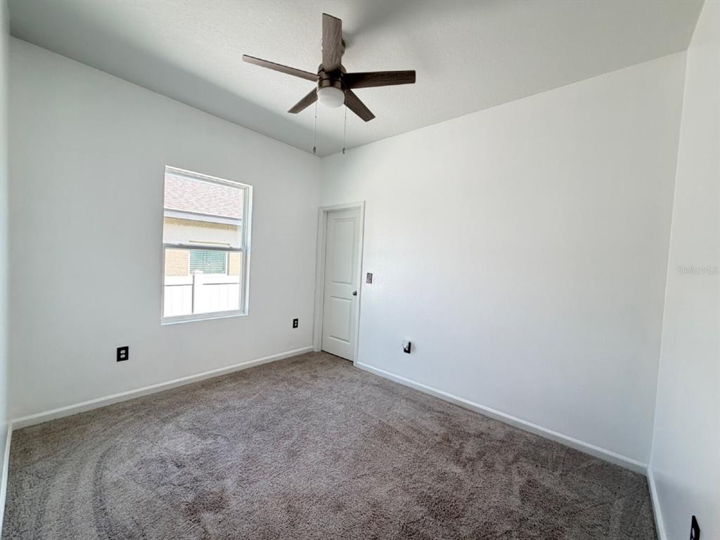 2021 Hemingway Circle Groveland, FL 34736 - Photo 8 of 18 a view of room with a ceiling fan and window