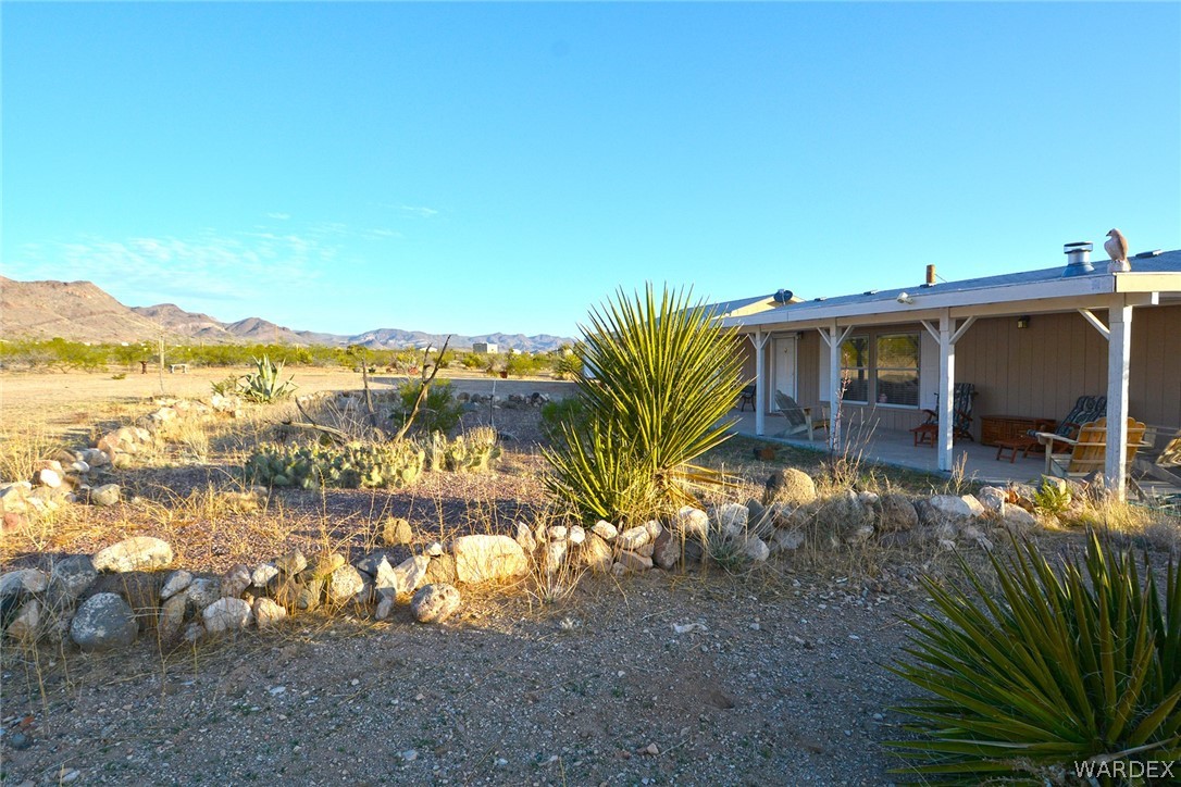 1854 Greer Road Golden Valley, AZ 86413 - Photo 32 of 48 a view of a house with a yard from a patio