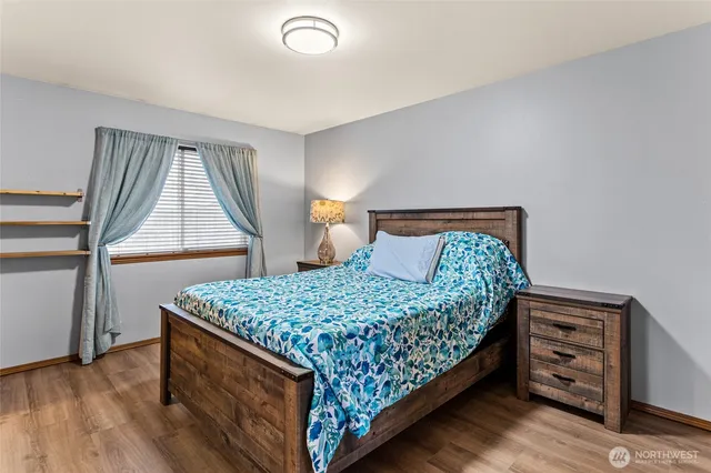 a bedroom with a bed and a dresser