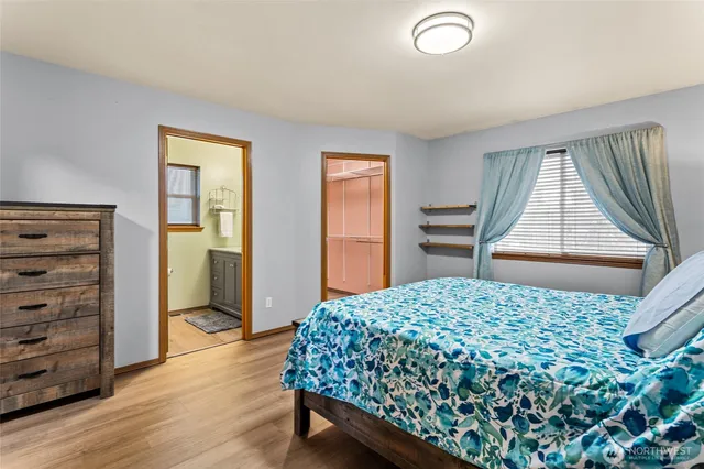 a bedroom with a bed and a dresser