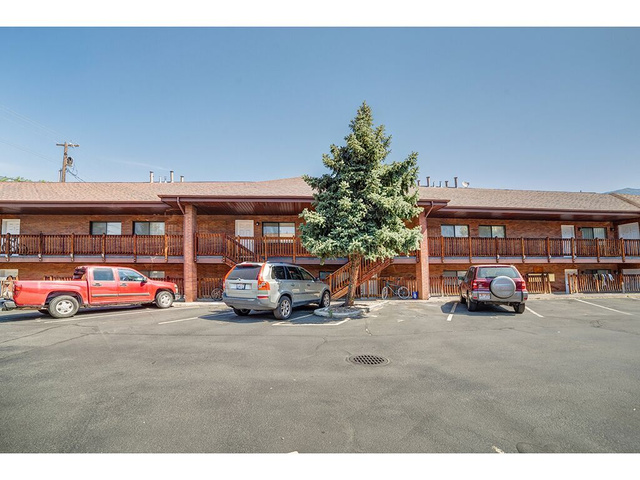 865 North 500 West, Unit 5 Provo, UT 84604 - Photo 11 of 14 Brick facade building with a multi-level design featuring private balconies and exterior stair access