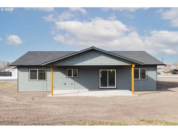 a house with trees in the background
