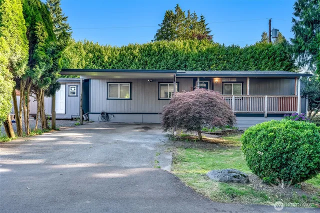 a house with a tree in front of it